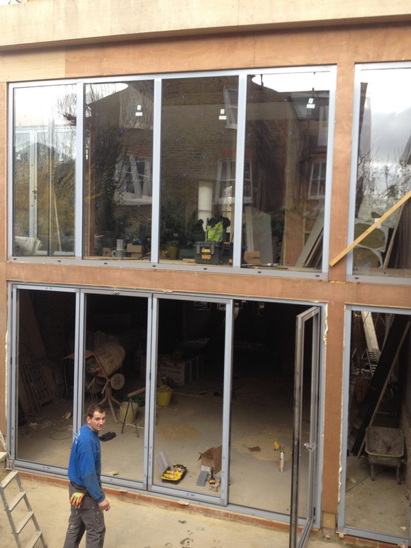 Aluminium bi-fold doors with two-storey glazing in Hammersmith