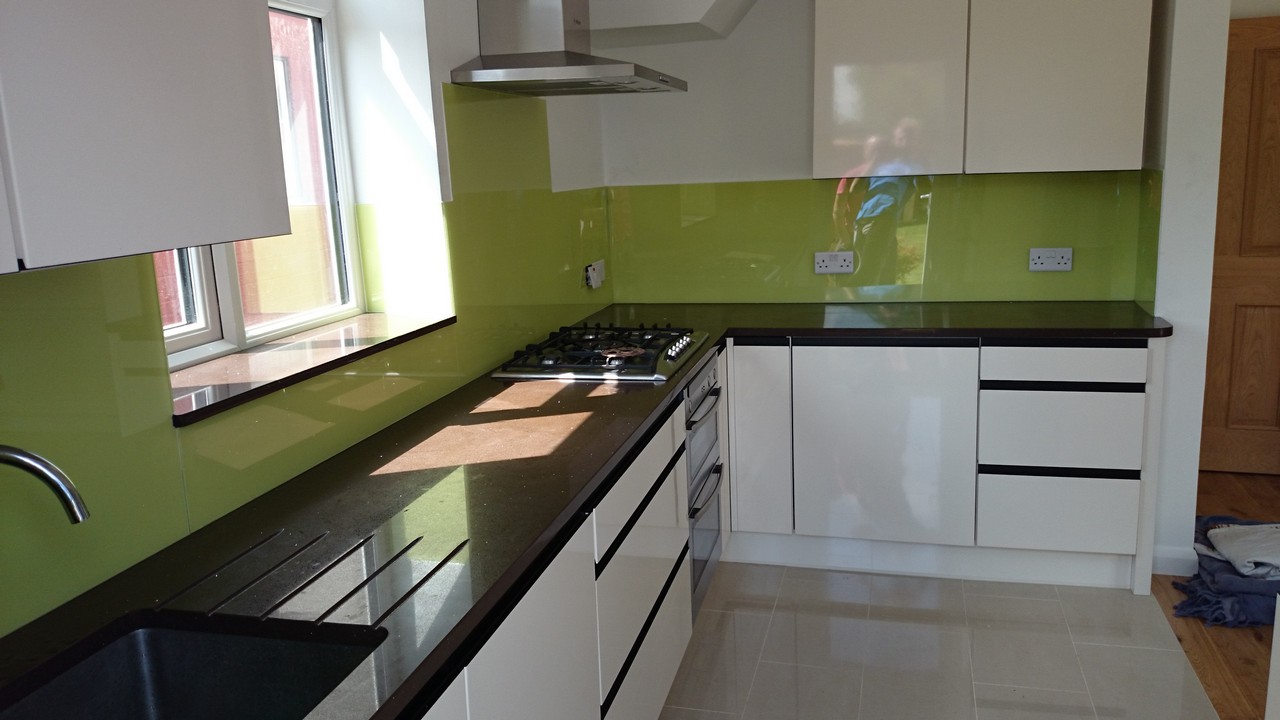Lime green glass kitchen splashback installed by Hammersmith glaziers