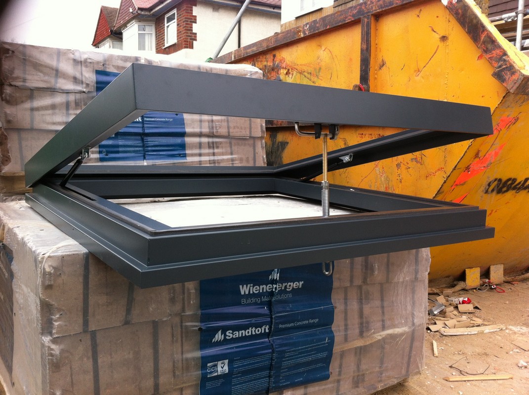 Opening flat roof skylight in anthracite grey installed in Hammersmith