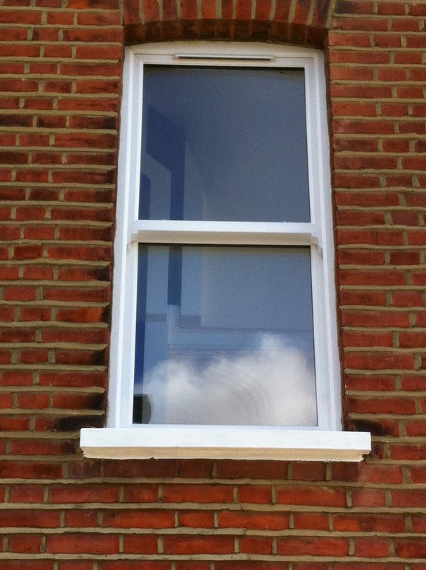 uPVC sash window on Victorian red brick house in Hammersmith